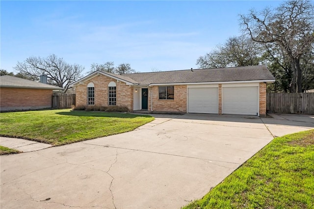 single story home with a garage and a front lawn