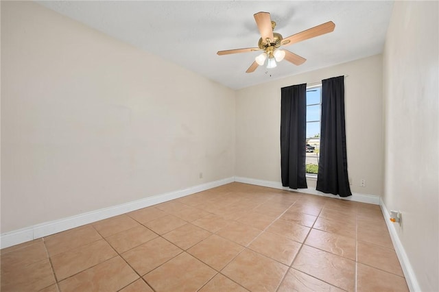 tiled empty room with ceiling fan