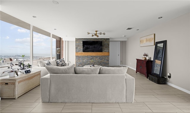 living room featuring floor to ceiling windows