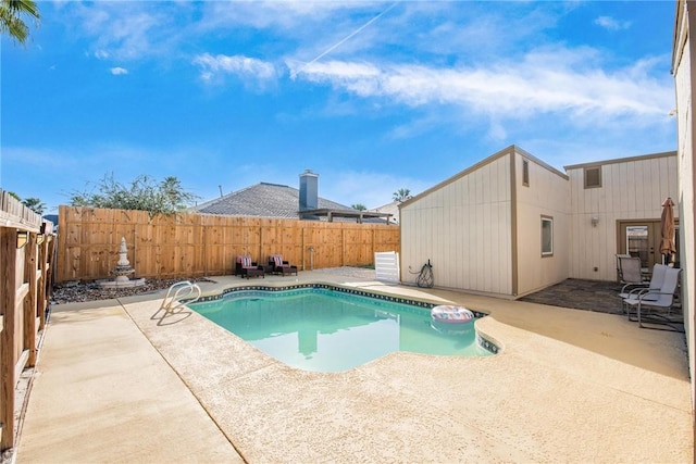 view of swimming pool featuring a patio