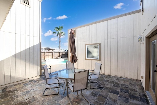 view of patio / terrace featuring a fenced in pool