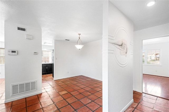 interior space featuring dark tile patterned flooring