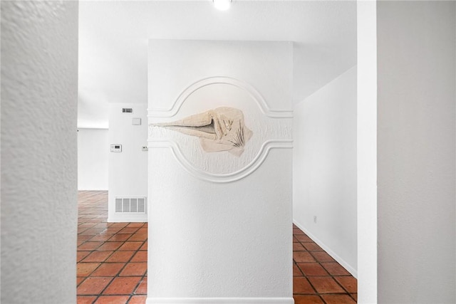 hallway featuring tile patterned flooring