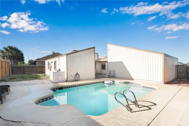 view of swimming pool with a patio area