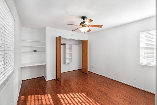 unfurnished bedroom with a closet, ceiling fan, and hardwood / wood-style flooring