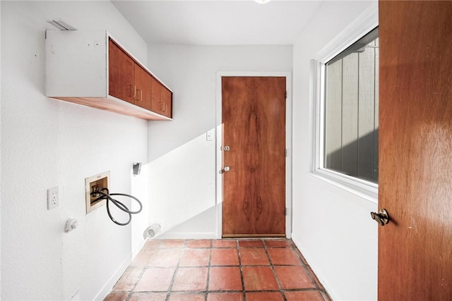 laundry room with cabinets and washer hookup