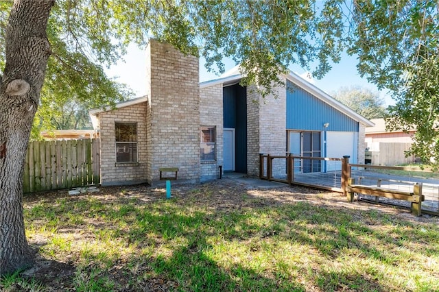 rear view of house with a deck