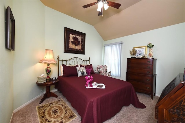 bedroom featuring lofted ceiling, light colored carpet, and ceiling fan