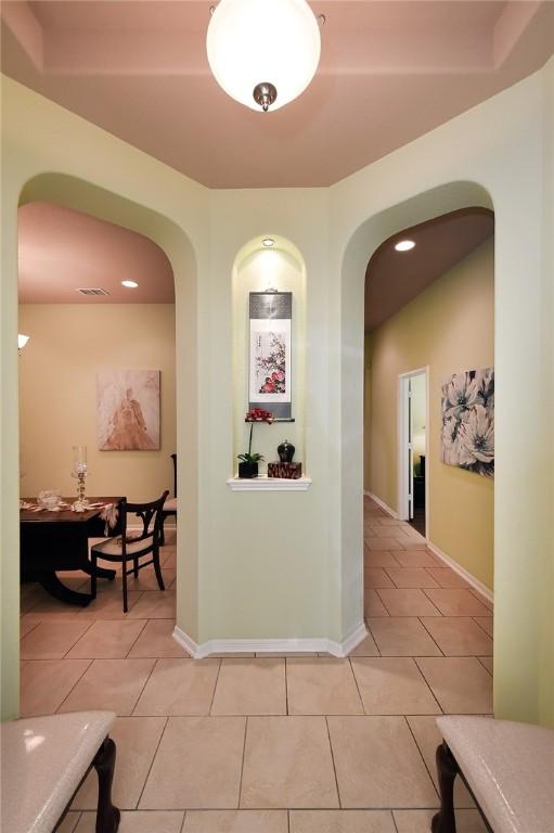 hallway with light tile patterned floors