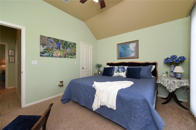 carpeted bedroom with vaulted ceiling and ceiling fan