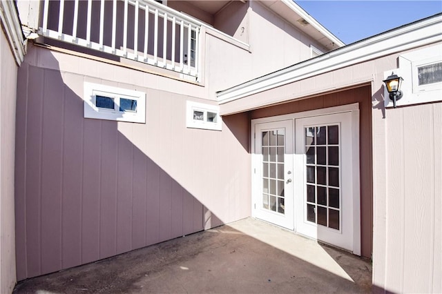 view of home's exterior featuring a patio area and french doors