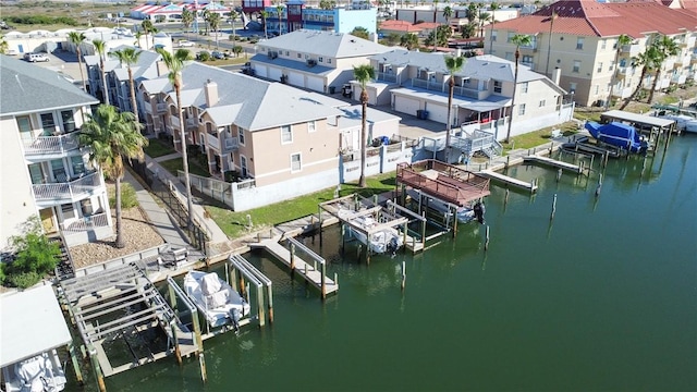 birds eye view of property featuring a residential view and a water view