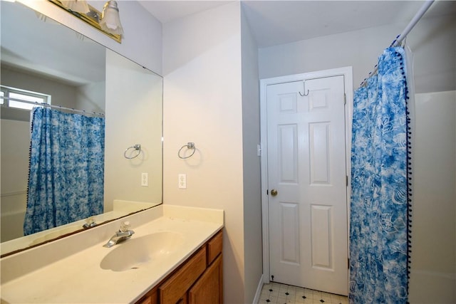 bathroom featuring a shower with shower curtain, vanity, and tile patterned floors