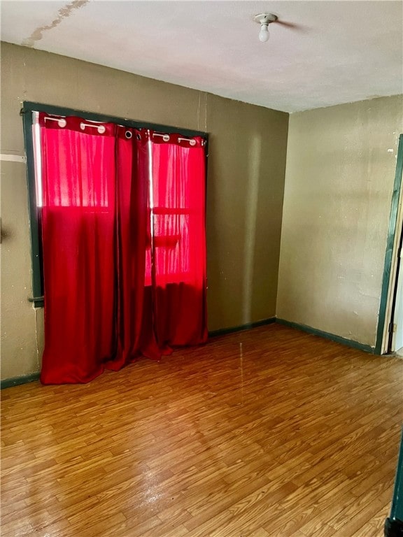 empty room featuring hardwood / wood-style flooring