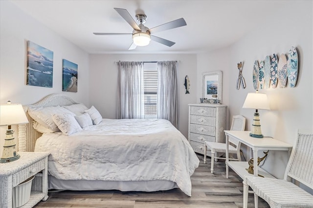 bedroom featuring hardwood / wood-style floors and ceiling fan