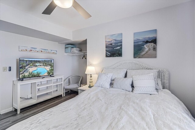 bedroom featuring dark wood-type flooring and ceiling fan