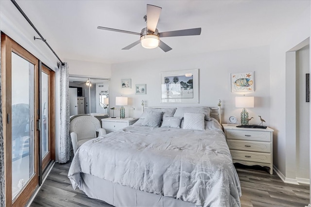 bedroom featuring dark hardwood / wood-style flooring, access to outside, and ceiling fan