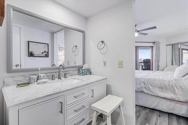 bathroom with vanity, wood-type flooring, and ceiling fan