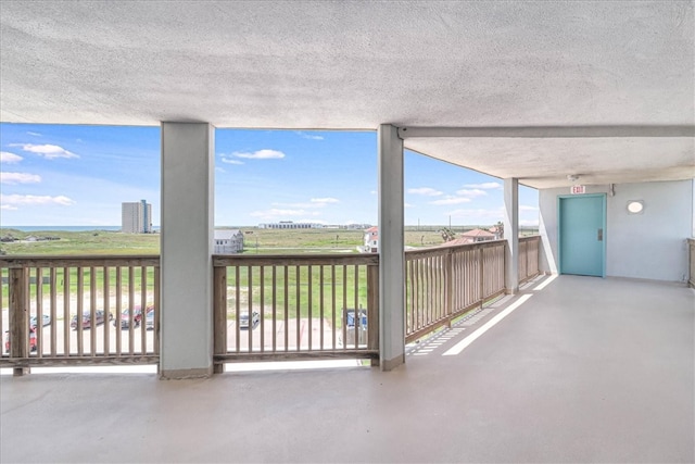 view of patio featuring a balcony