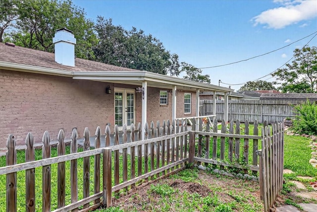 11129 Mulholland Dr, Corpus Christi, TX 78410 - fenced yard featuring french doors