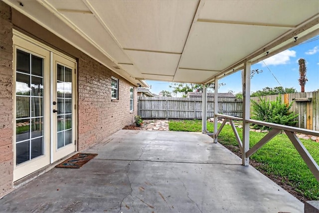 11129 Mulholland Dr, Corpus Christi, TX 78410 - fenced backyard with a patio area and french doors