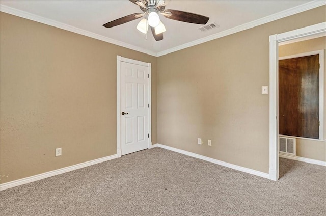 11129 Mulholland Dr, Corpus Christi, TX 78410 - spare room featuring carpet floors, ceiling fan, and crown molding