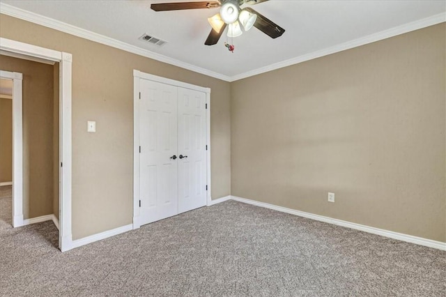 11129 Mulholland Dr, Corpus Christi, TX 78410 - unfurnished bedroom featuring carpet, crown molding, a closet, and ceiling fan