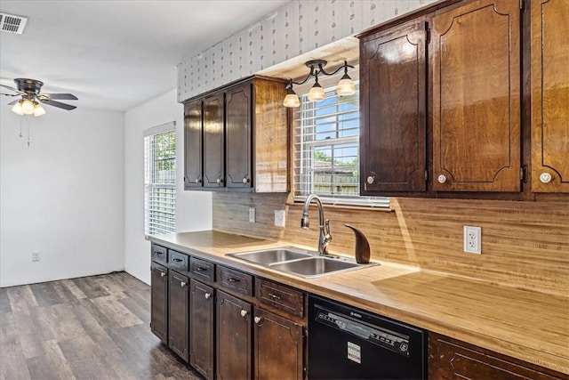 11129 Mulholland Dr, Corpus Christi, TX 78410 - kitchen with black dishwasher, ceiling fan, tasteful backsplash, dark wood-style flooring, and dark brown cabinets