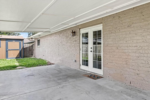 11129 Mulholland Dr, Corpus Christi, TX 78410 - view of patio with a storage shed and french doors