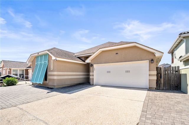 single story home featuring a garage