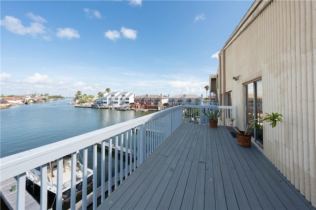 wooden deck featuring a water view