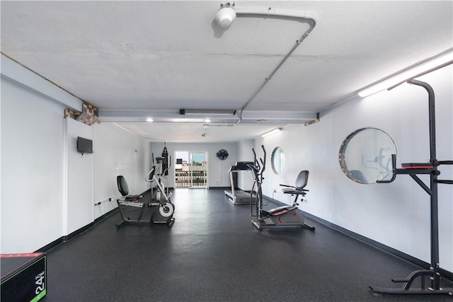 exercise room with baseboards