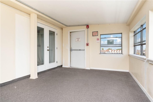 unfurnished sunroom with french doors