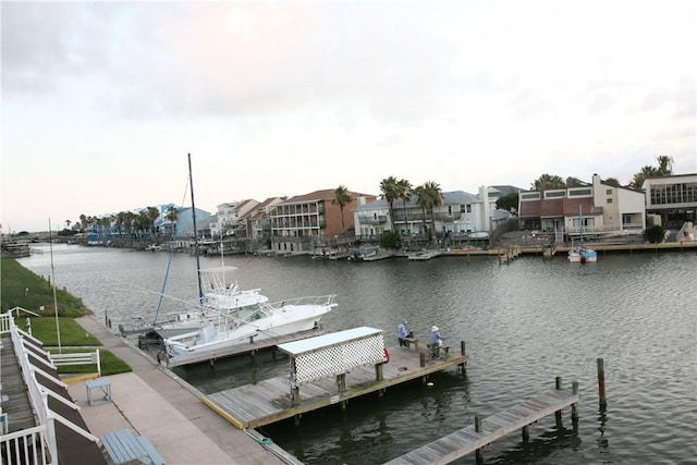 dock featuring a water view and a residential view