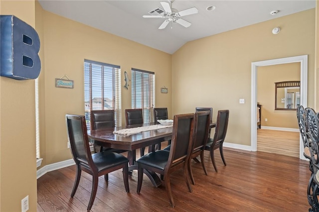 227 Windjammer St, Rockport, TX 78382 - dining area with wood finished floors, ceiling fan, vaulted ceiling, and baseboards