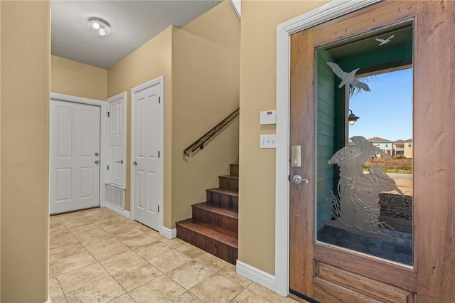 227 Windjammer St, Rockport, TX 78382 - tiled entrance foyer with stairway and baseboards