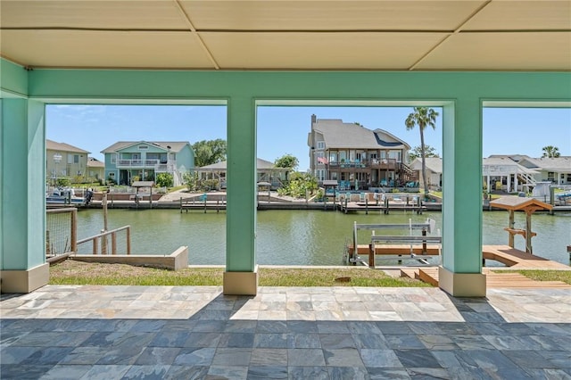 227 Windjammer St, Rockport, TX 78382 - view of patio with a boat dock, a water view, and a residential view