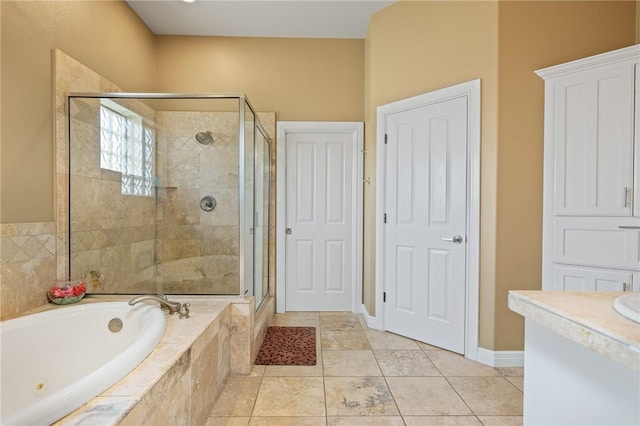 227 Windjammer St, Rockport, TX 78382 - full bath featuring a bath, a stall shower, vanity, baseboards, and tile patterned flooring