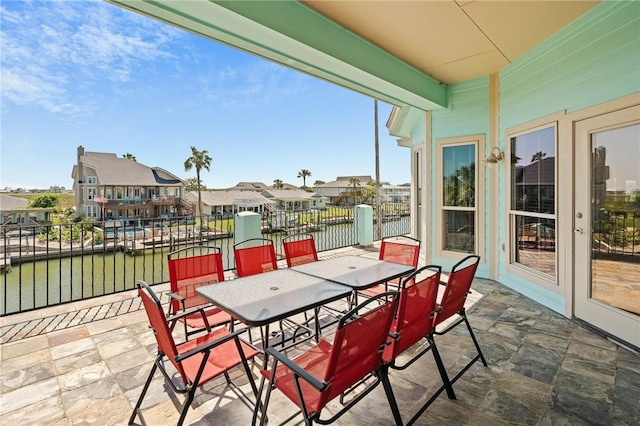 227 Windjammer St, Rockport, TX 78382 - view of patio featuring a water view, outdoor dining space, and a residential view
