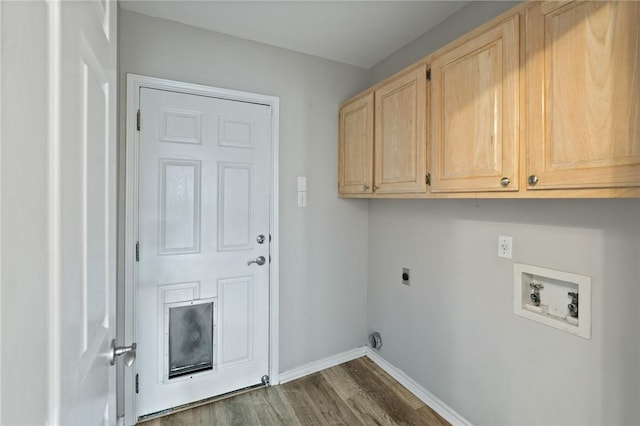 laundry area featuring cabinets, washer hookup, dark hardwood / wood-style floors, and hookup for an electric dryer