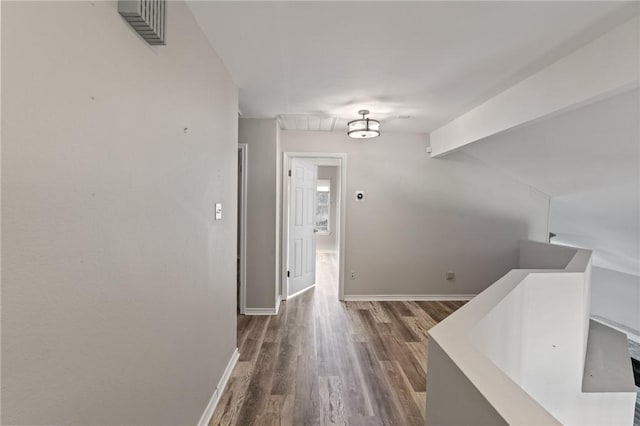 13845 Jolly Roger St, Corpus Christi, TX 78418 - corridor featuring wood finished floors, an upstairs landing, and baseboards
