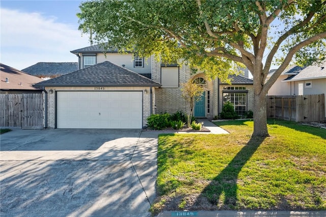 13845 Jolly Roger St, Corpus Christi, TX 78418 - traditional-style house with a garage, concrete driveway, brick siding, and roof with shingles
