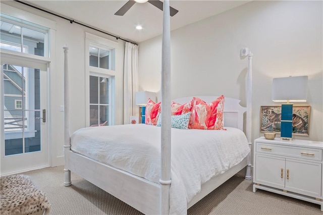 bedroom featuring light colored carpet, access to exterior, and ceiling fan