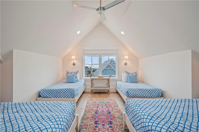 bedroom featuring lofted ceiling, light hardwood / wood-style flooring, and ceiling fan