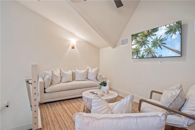 living room with lofted ceiling, hardwood / wood-style floors, and ceiling fan