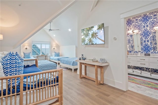 bedroom featuring vaulted ceiling and light wood-type flooring