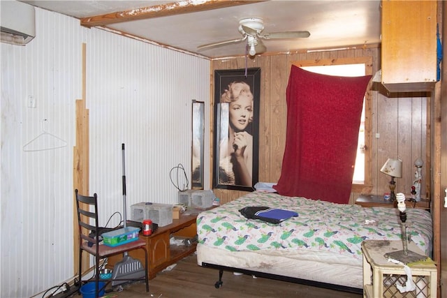 bedroom featuring wood-type flooring and wood walls