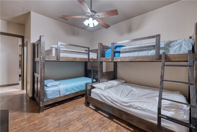 bedroom with ceiling fan and wood-type flooring