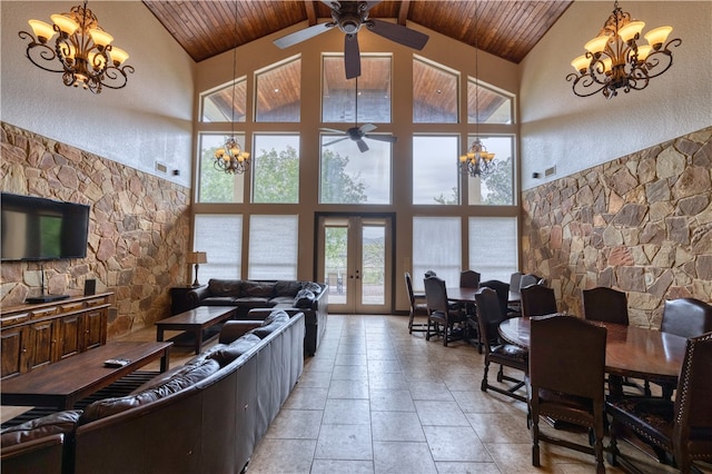 living room with high vaulted ceiling, french doors, and wooden ceiling