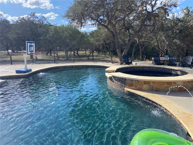 view of pool with an in ground hot tub